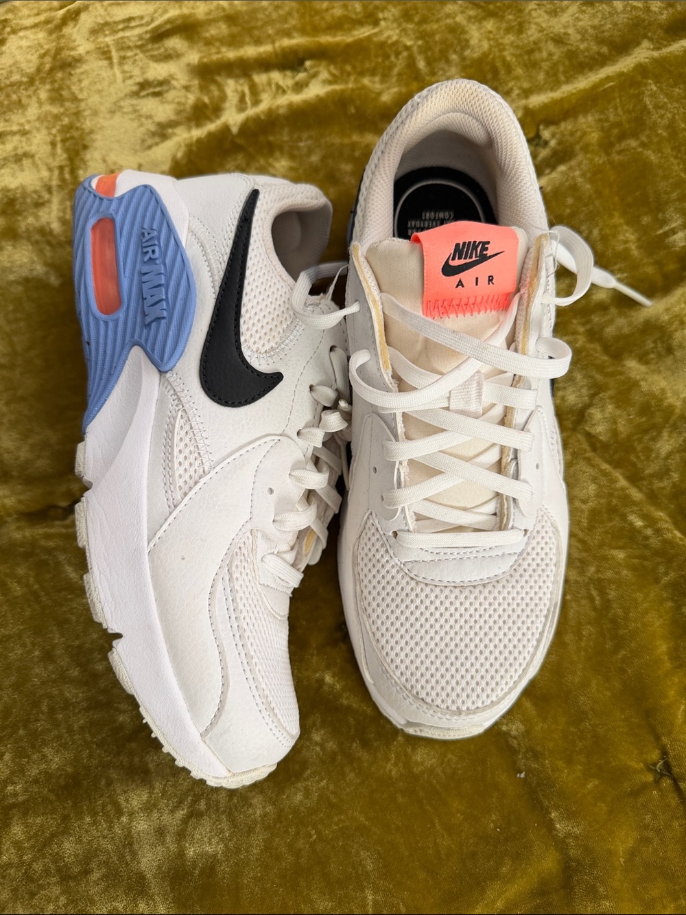 Nike Women’s Sneakers in White with Black Swoosh and Coral Accent